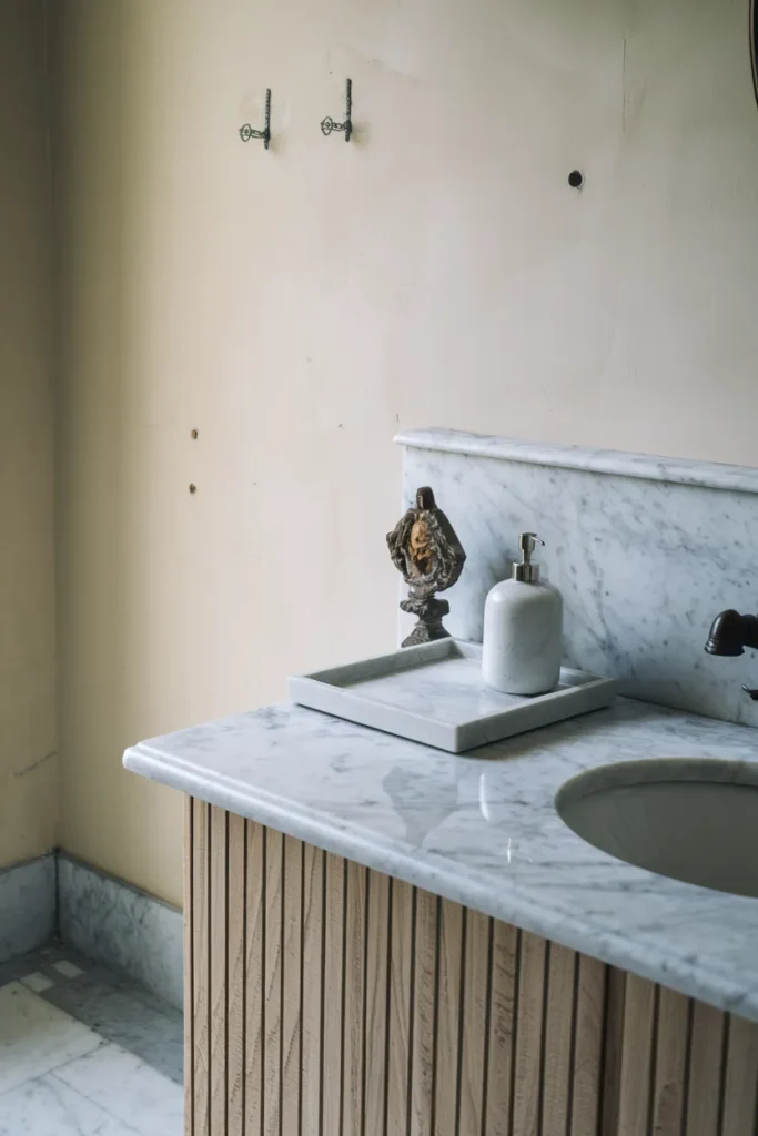 bathroom with marble countertop