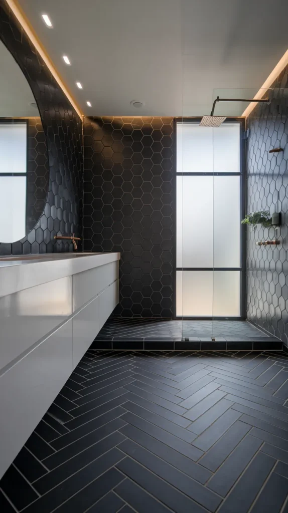 Industrial bathroom with textured black concrete floors, exposed copper pipes, and a reclaimed wood vanity.